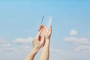 Female touching interface of transparent model of smartphone