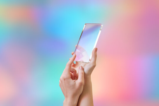 People keeping new model of cellular phone made of clear material