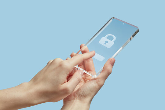 Unrecognizable human unlocking modern smartphone with touch id