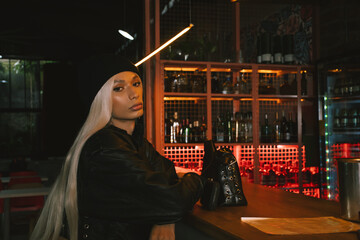 Portrait of a confident woman at a bar