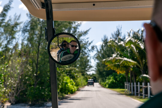 Family Riding in a Golf Cart in Green Turtle Cay, Abacos, Bahamas