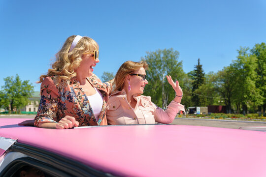 Stylish women smear from limo
