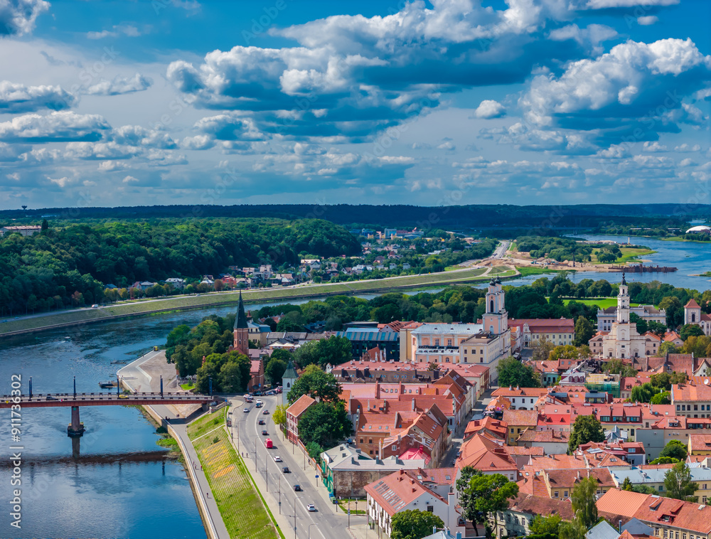 Wall mural Kaunas old town, Lithuania. Panoramic drone aerial view photo of Kaunas city center with many red roof houses, churches and other historical building