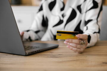 Close up image of female hands holding a debit card 