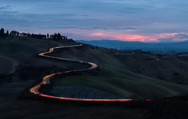 mountain road in night in tuscany