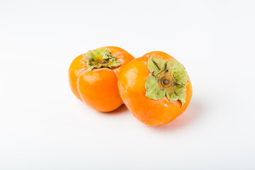 Fresh Kakis on white background
