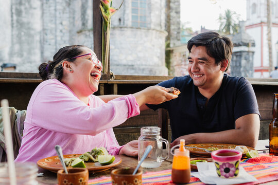 Couple eating and having fun in a restaurant.