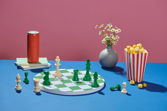 Chess Game Setup with Snacks and Beverage