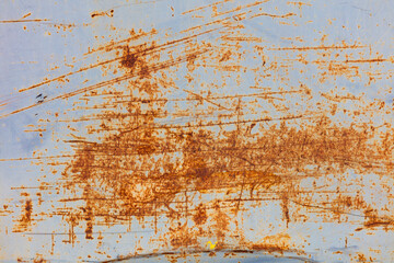 Peeling paint and rusty marks on metal