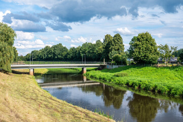 The Hase river and green surroundings on a sunny day in Löningen, Lower Saxony, Germany