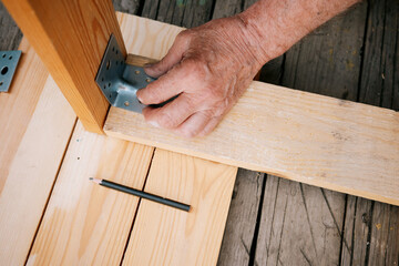 Anonymous hand of senior carpenter