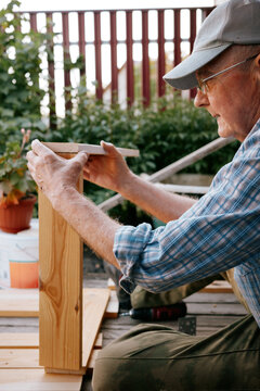 Senior Man Woodworking Outdoors