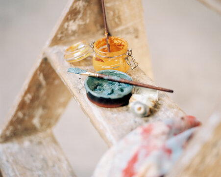 Paintings on a wooden ladder