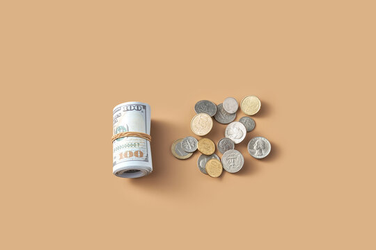 Scroll of one hundred dollars banknotes placed aside of cents