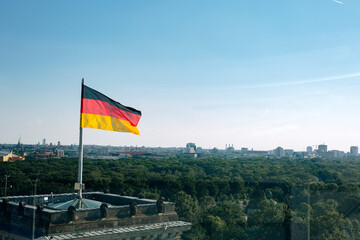 German Flag Flying Over Berlin Skyline