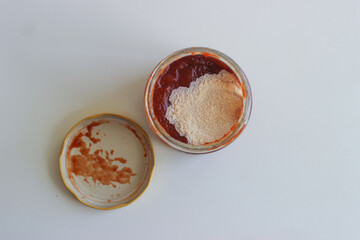 open tomato sauce jar with white mold, spoiled food, food disposal