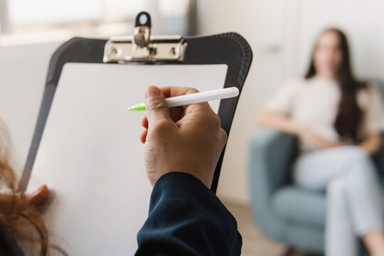 Woman taking therapy with psychologist.