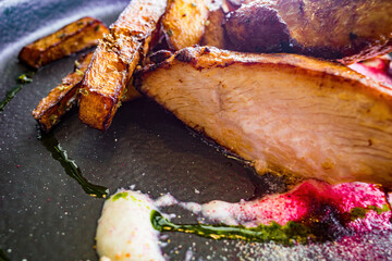 fried turkey slices with cheese fried pumpkin slices and sauce close-up and natural light