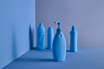 Minimalistic Arrangement of Blue Plastic Bottles on a Blue Background