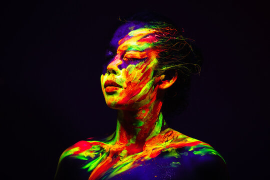 Person with Neon Abstract Face and Body Paint