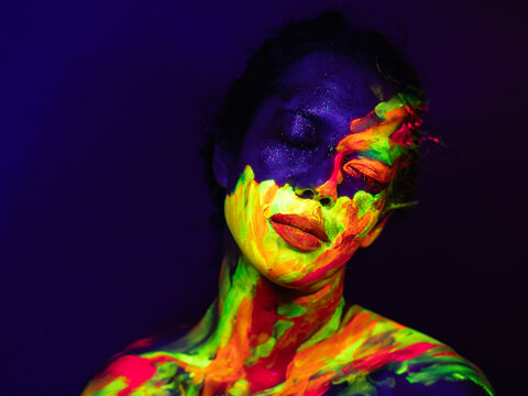 Person with Neon Abstract Face and Body Paint - Powered by Adobe