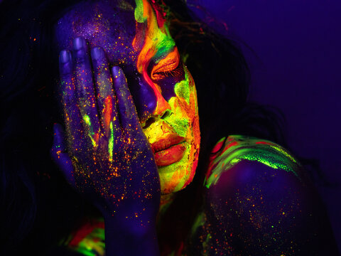 Person with Neon Abstract Face and Body Paint