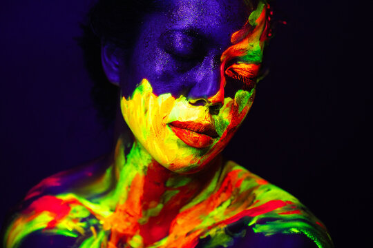 Person with Neon Abstract Face and Body Paint