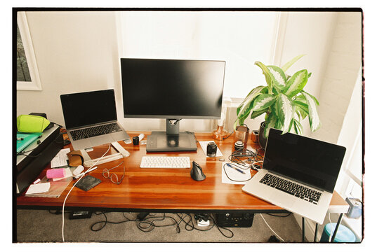 Messy home office desk