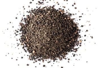 A pile of black pepper seeds on a white surface