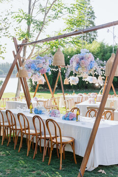 Elegant Outdoor Wedding Dining Area with Floral Decor