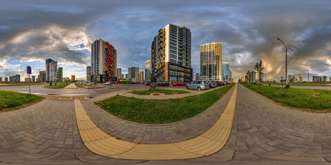 hdri 360 panorama near new skyscrapers and residential complex at evening in full equirectangular...