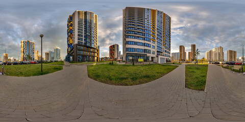 hdri 360 panorama near new skyscrapers and residential complex at evening in full equirectangular...