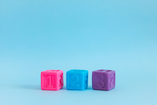 Сolorful plastic cubes with numbers lined up 