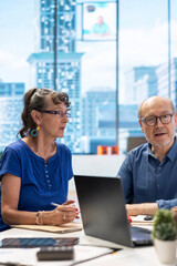 Senior people discussing a pension financial strategy with broker, receiving advice from agency expert to secure future income and family expenses. Guaranteeing life insurance plans.