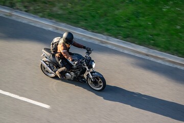 Fototapeta premium Rider on motorcycle with motion blur effect