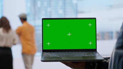 Real estate experts and business owner review blueprints plan next to isolated mockup, working on...