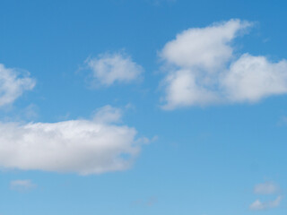 Fototapeta premium Blue sky background with white clouds