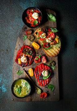 Bruschetta with basil pesto and mozzarella cheese