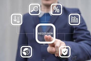 Recession Economy Crash Concept. Business man working on virtual touch screen presses word: RECESSION.