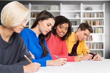 Group of students study materials in school library