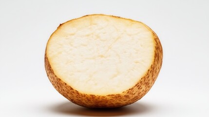Detailed half of a yellow yam, showing its pale interior and rugged skin texture. Set on a clean, white backdrop for contrast