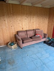 Abandoned Living Room with Worn Sofa