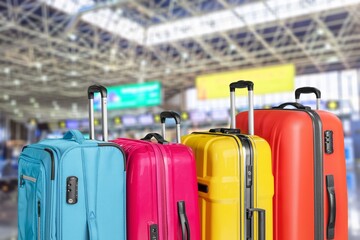 Travel suitcases in airport hall waiting for vacation