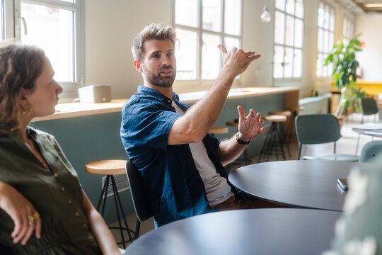 Diverse Coworkers During Coffee Break In Modern Office
