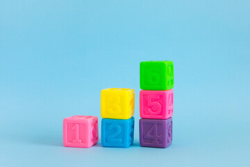 Сolorful plastic cubes with numbers lined up 