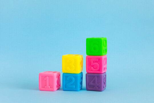 Сolorful plastic cubes with numbers lined up 