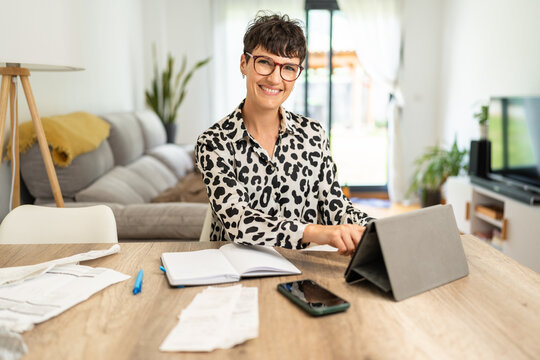 Accountant woman making monthly accounts with receipts