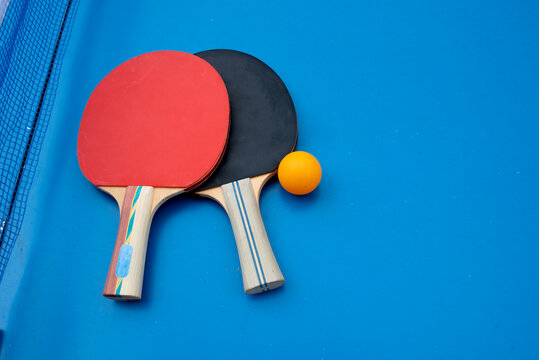 Two ping pong paddles