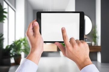 A businessman hands holds digital tablet blank screen