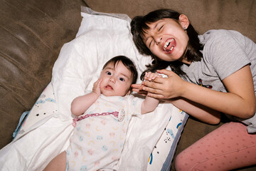 Happy Siblings on Couch
